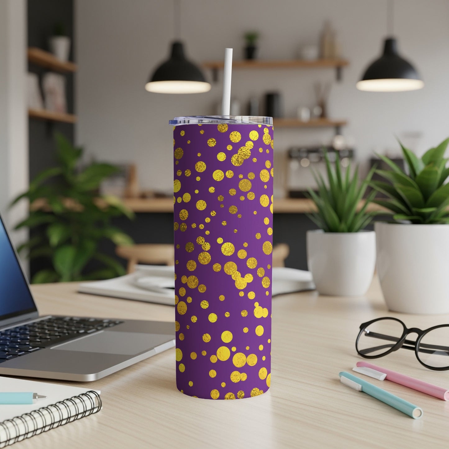 Purple tumbler with gold polka dots, featuring a white straw and lid.