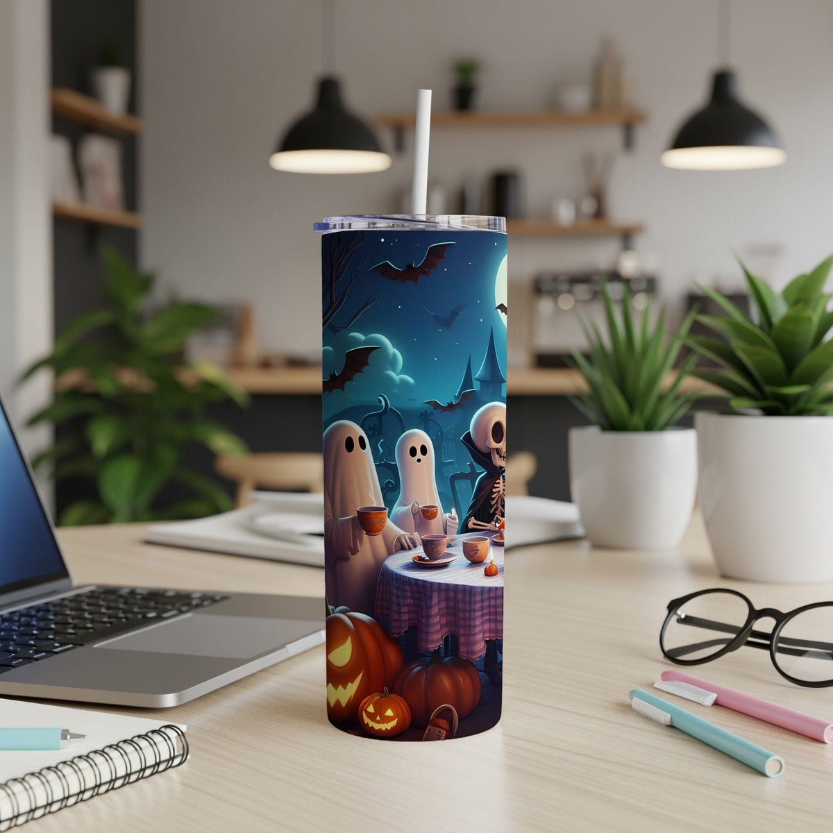 Halloween tumbler with ghosts, skeleton, bats, moon, and pumpkins.