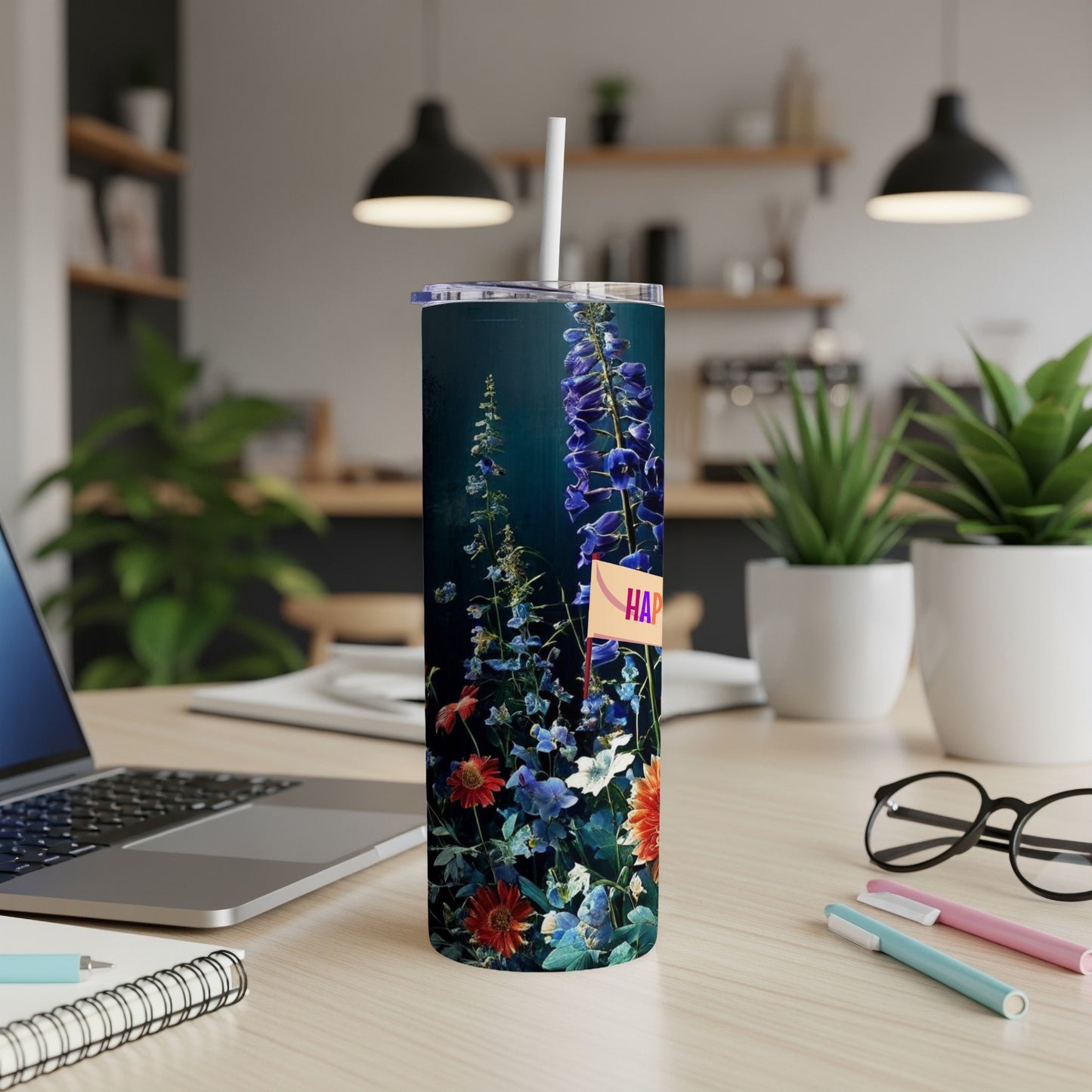 Dark tumbler with colorful floral pattern and "Happy" flag.