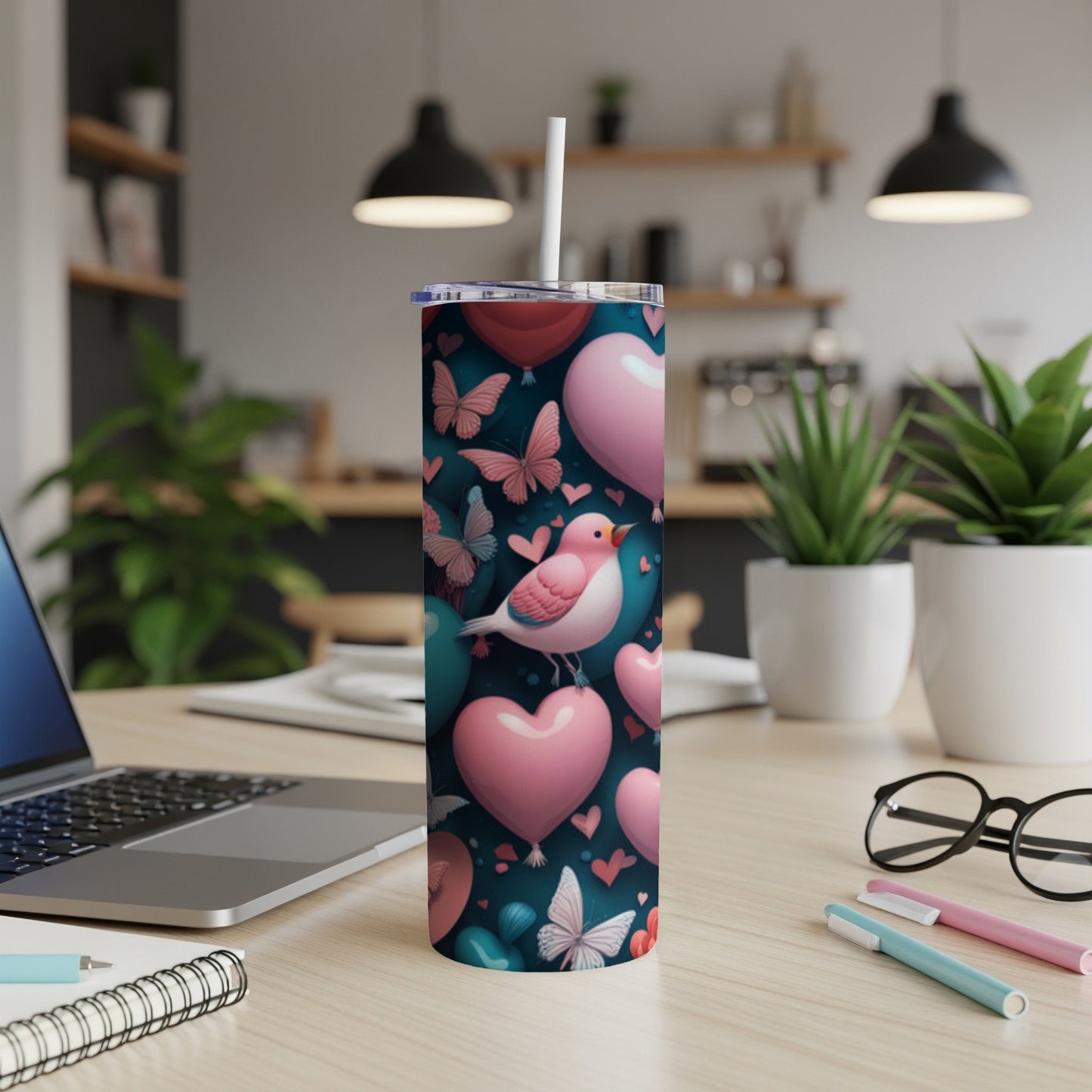 Pink and blue hearts and butterflies pattern on a skinny tumbler.
