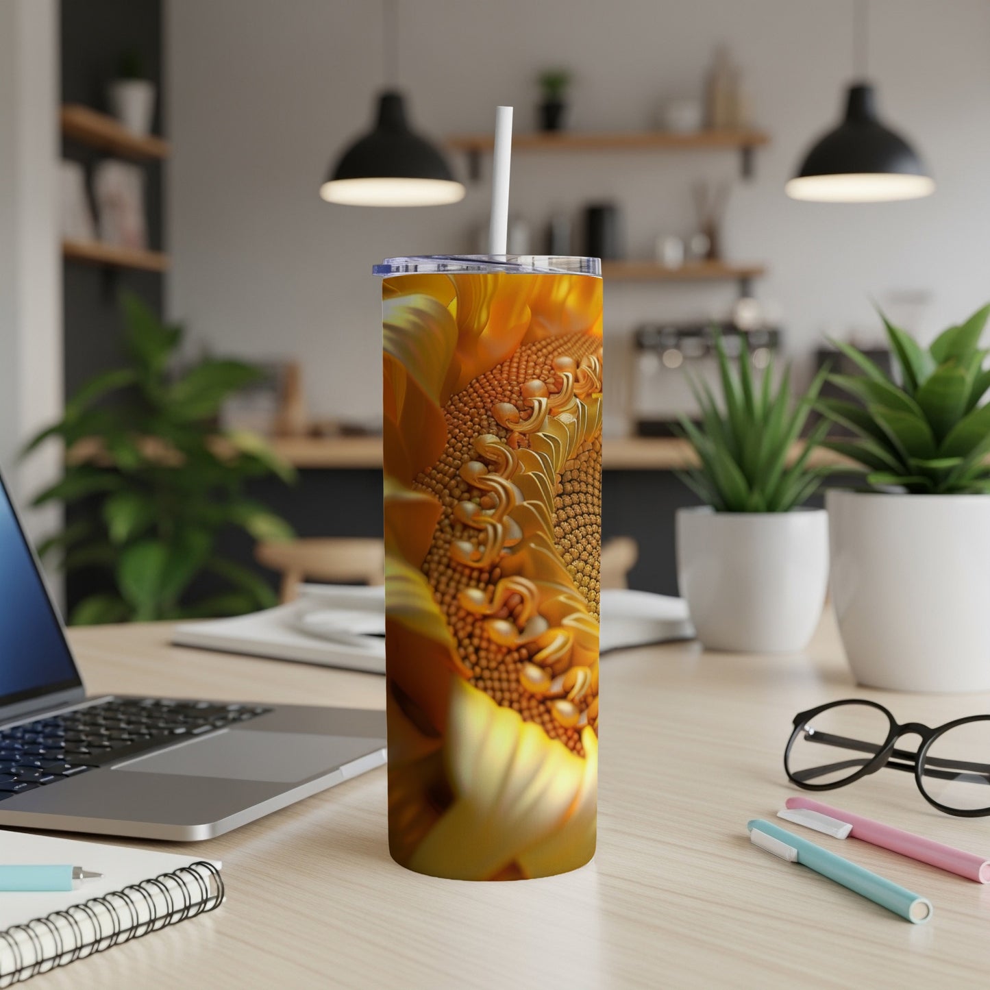 Sunflower pattern on a stainless steel tumbler with a straw.