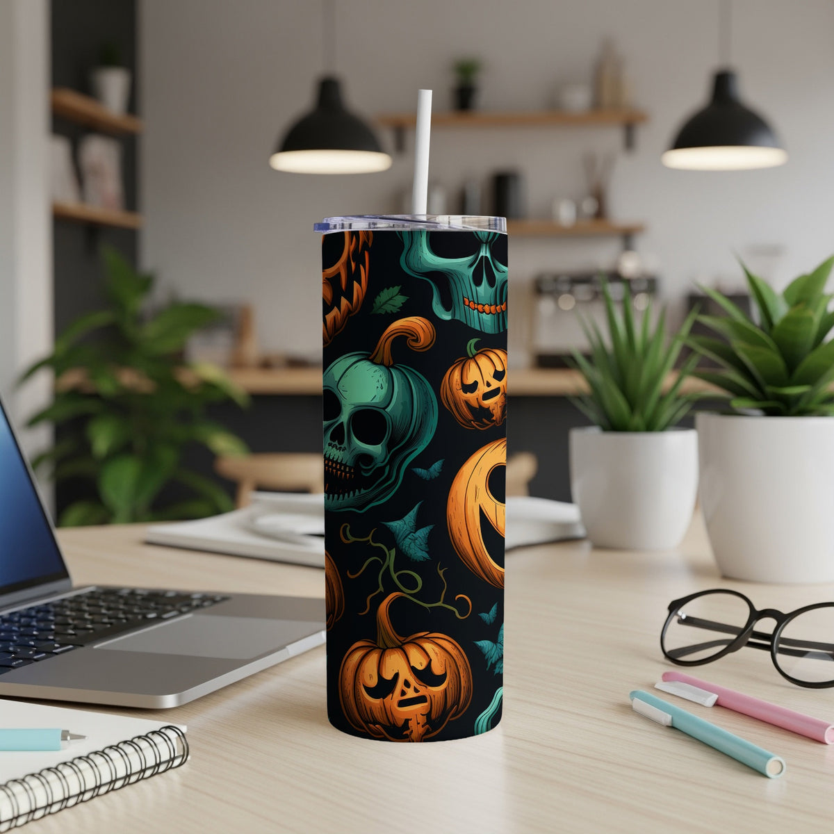 Tall tumbler with a Halloween pattern of pumpkins and skulls.