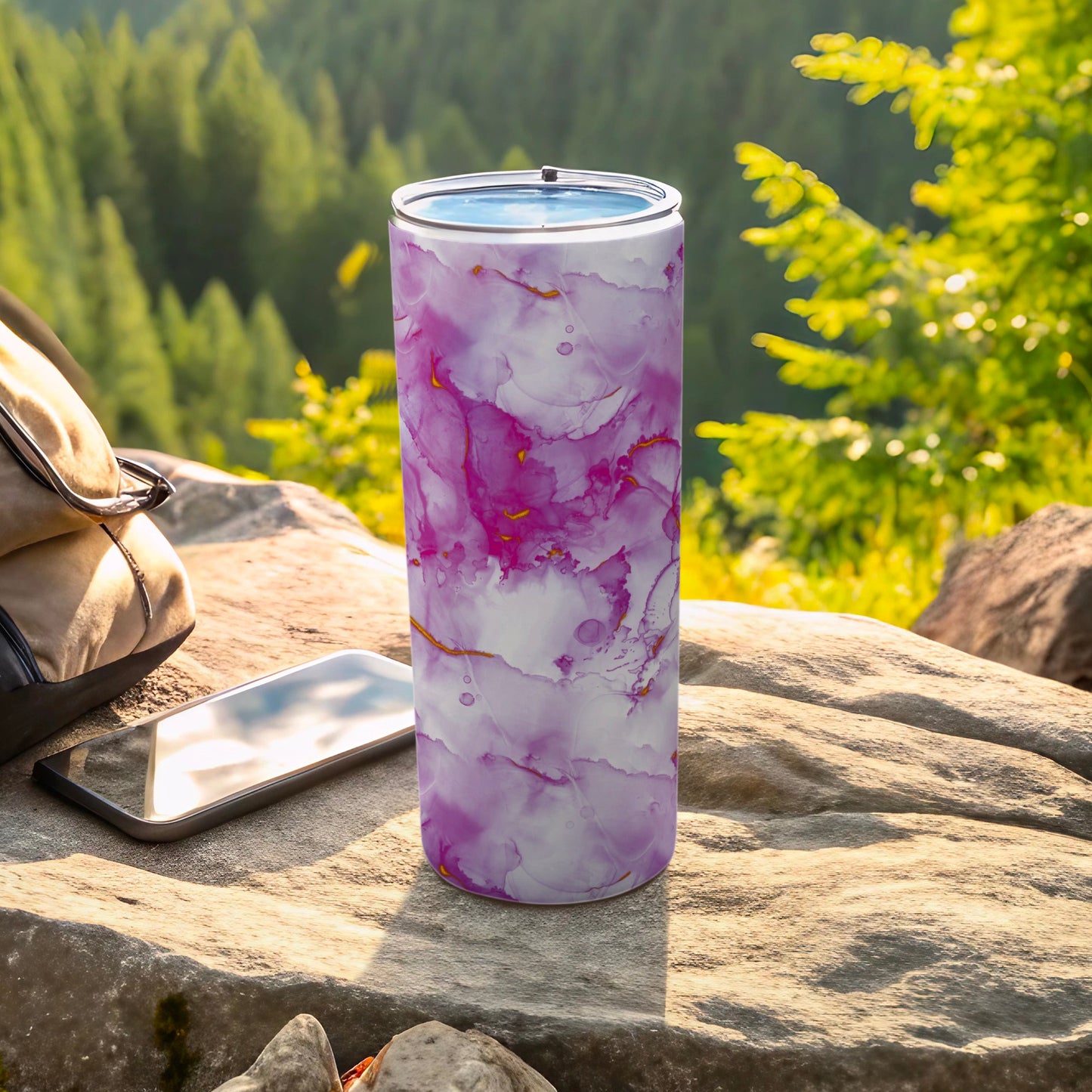 Purple and pink marble pattern insulated tumbler with gold accents.