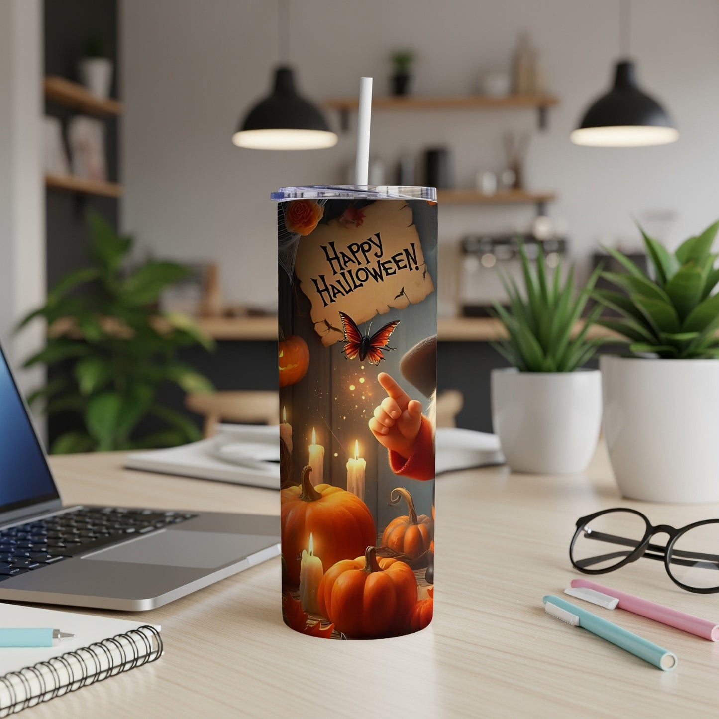 Tumbler with pumpkins, candles, and a butterfly on a "Happy Halloween" scroll.