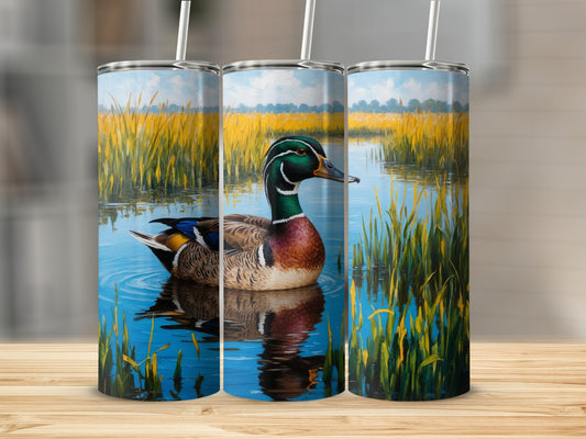 Mallard duck swimming in calm water with reeds and blue sky.