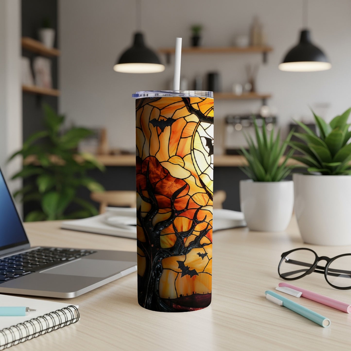 Orange stained glass tumbler with bats and a spooky tree under a full moon.