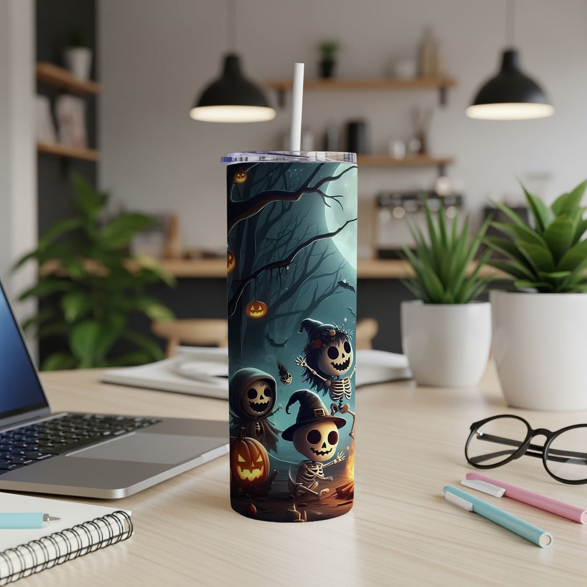 Tumbler with spooky Halloween cartoon characters around a campfire under a full moon.
