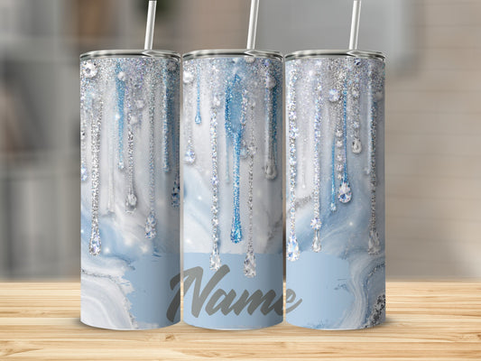 Three tumblers with blue marbled design, glitter drips, and jewel accents.