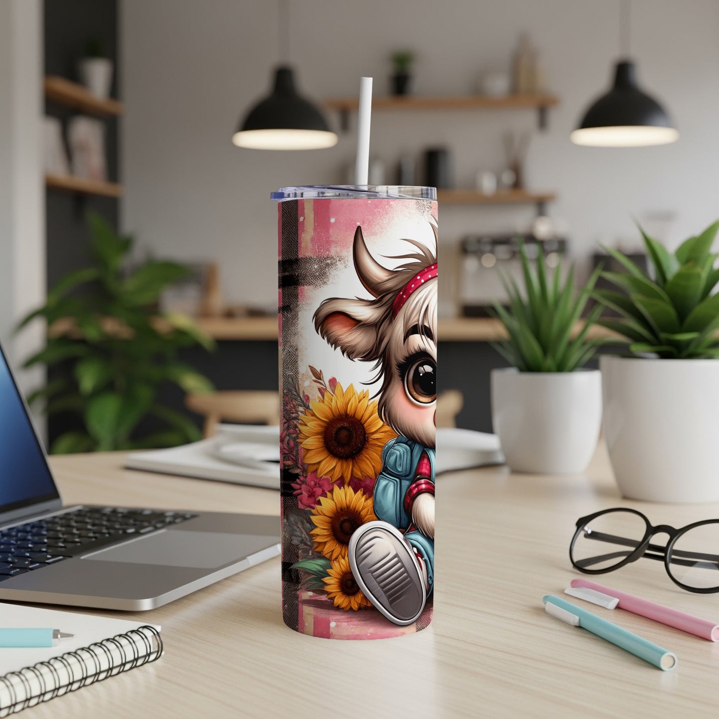 Cute cartoon cow with sunflowers on a pink and white tumbler.