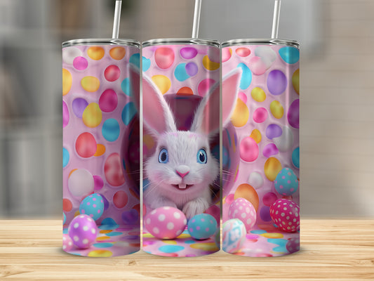 Easter bunny peeking from behind colorful polka dot eggs on a pink background.