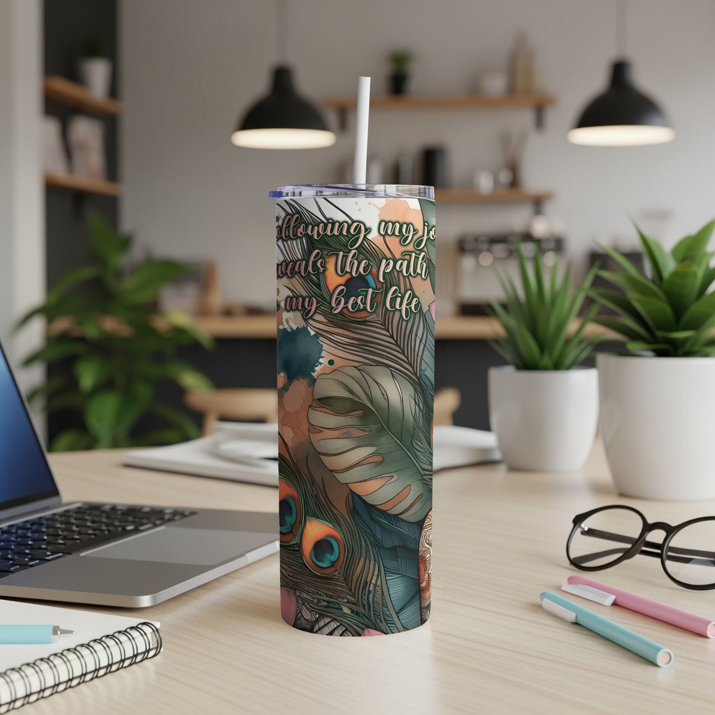 Tumbler with peacock feathers and inspirational text "following my joy leads the path to my best life".