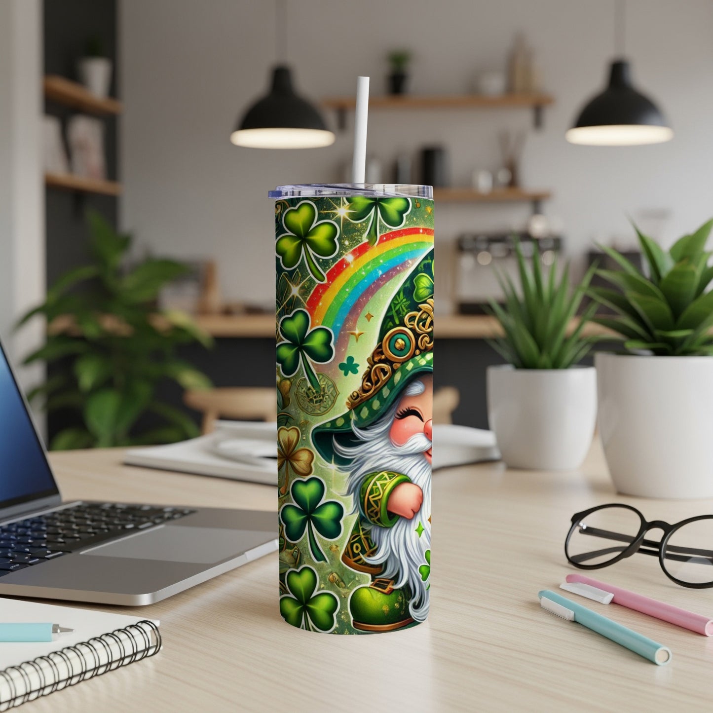 Leprechaun with rainbow and shamrocks on a green patterned tumbler.