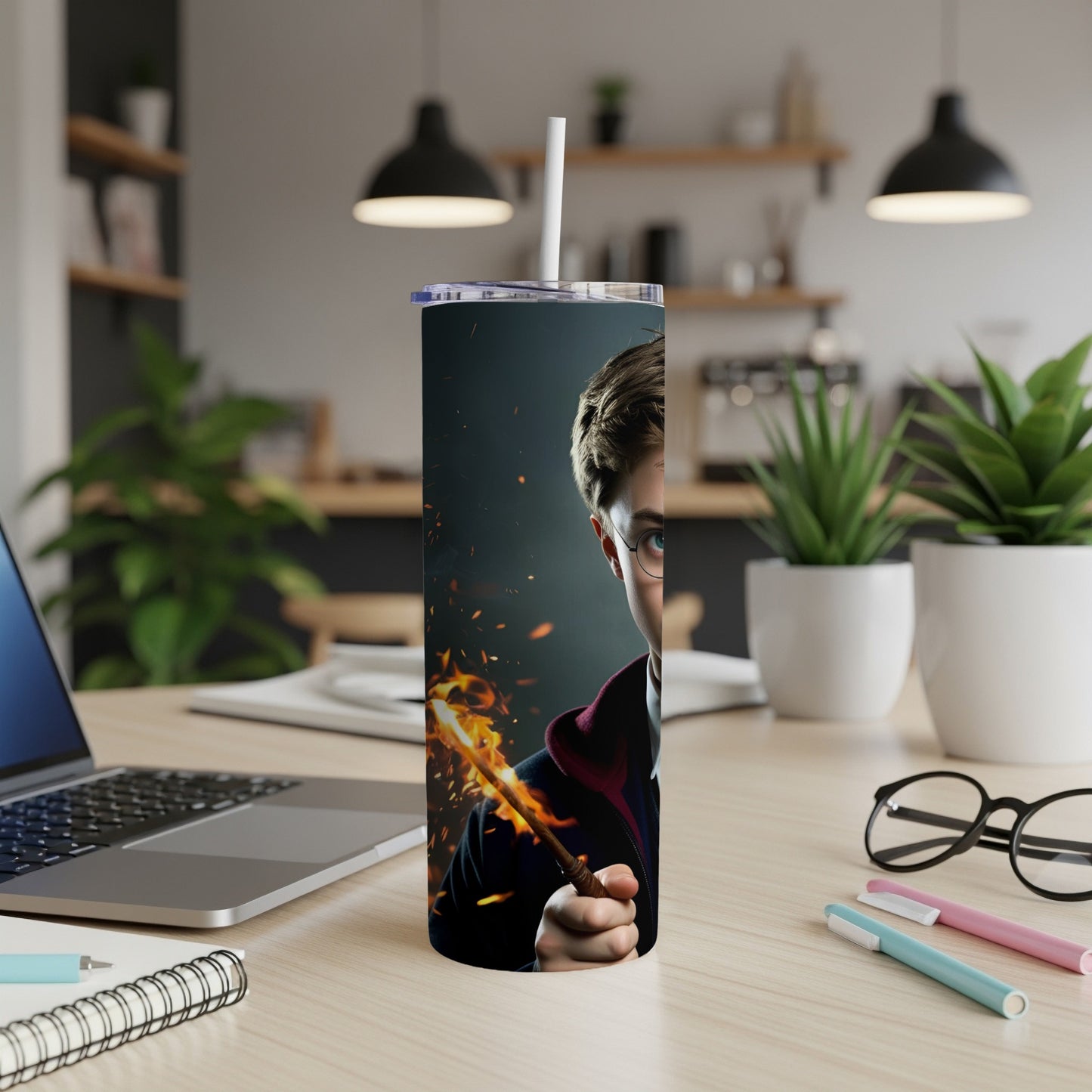 Harry Potter character holding a wand emitting fire, on a tumbler.