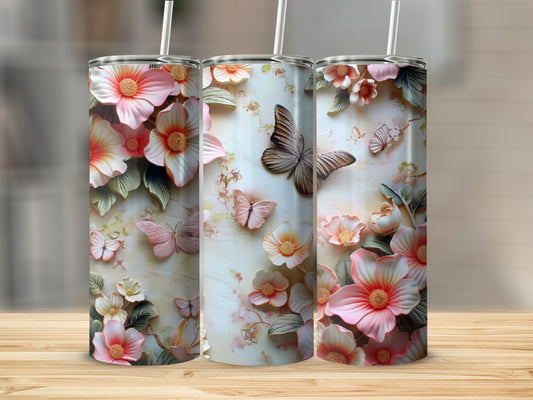 Three tumblers with 3D floral and butterfly designs.