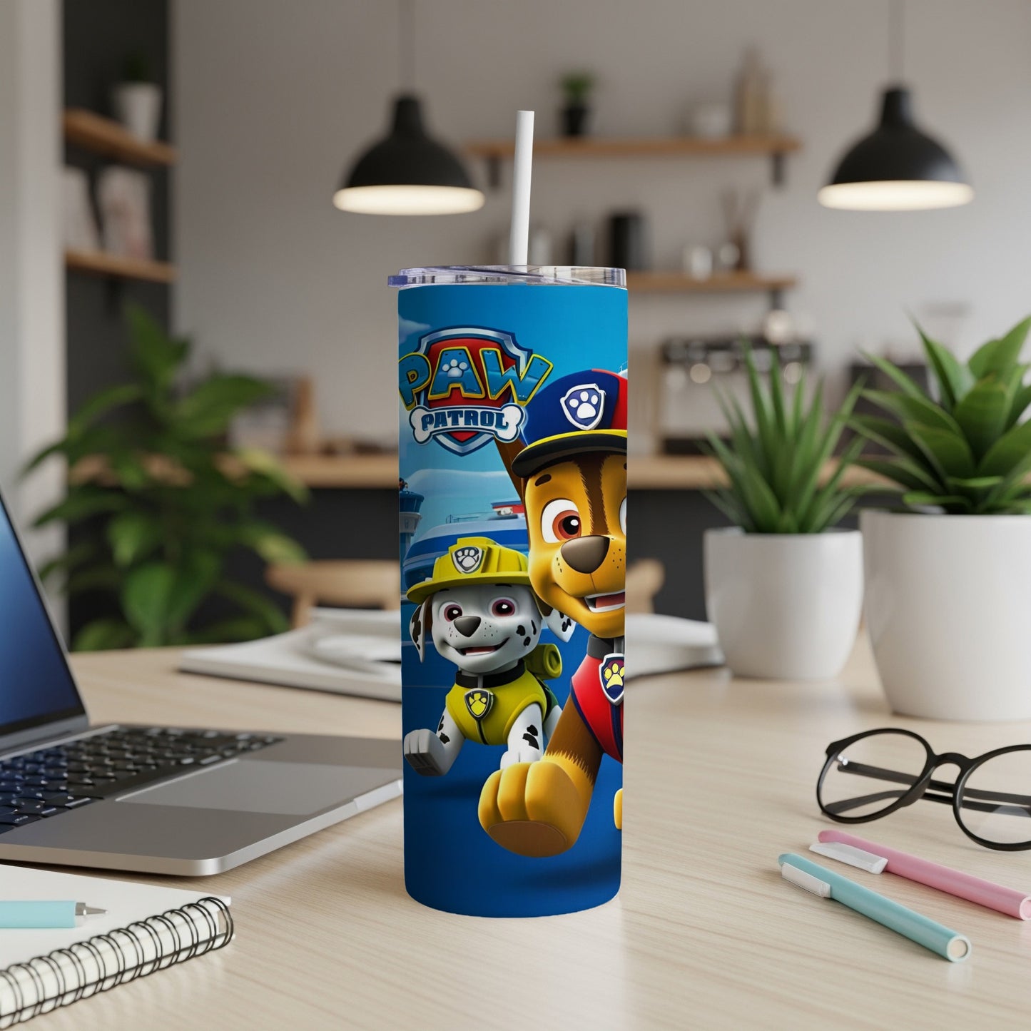 Paw Patrol characters Chase and Marshall on a blue cylindrical tumbler.