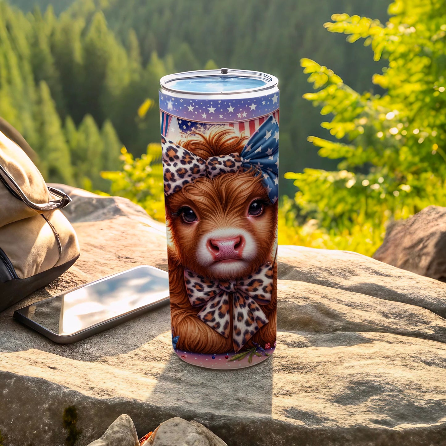 Highland cow tumbler with patriotic bow and leopard print accents.