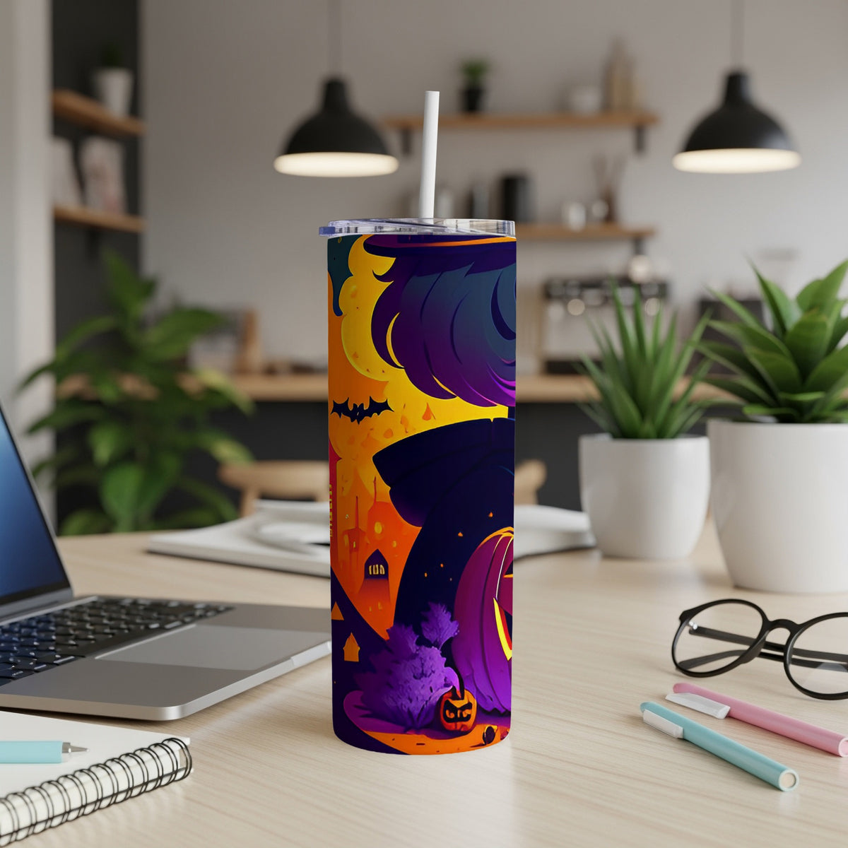 Tall tumbler with a Halloween design featuring bats, a pumpkin, and a spooky cityscape.