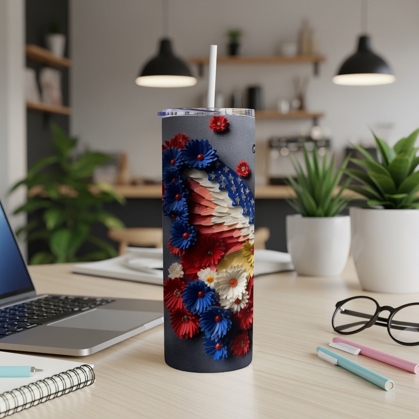 Tumbler with patriotic floral design and American flag accents.