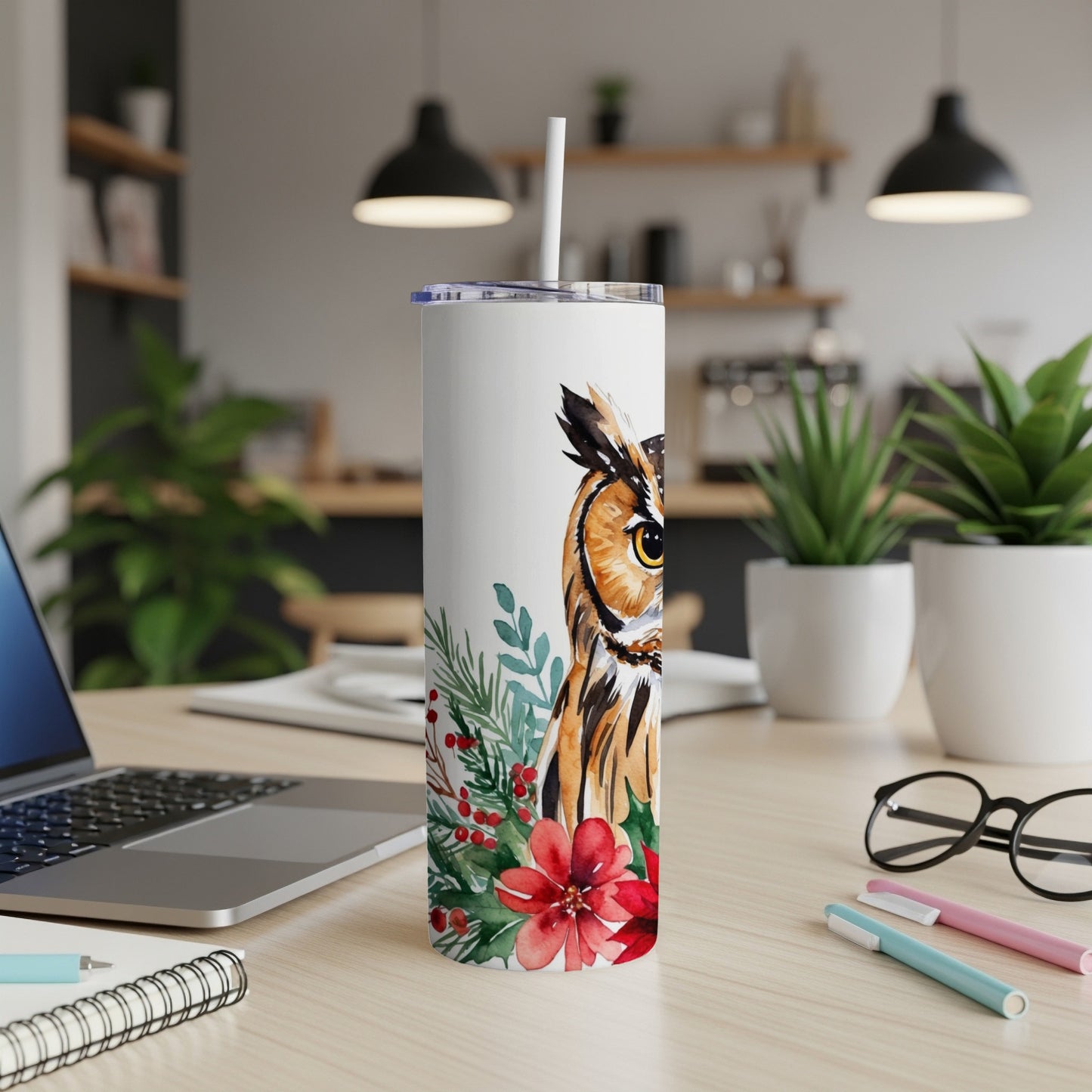 Watercolor owl illustration on a white insulated tumbler with a straw.
