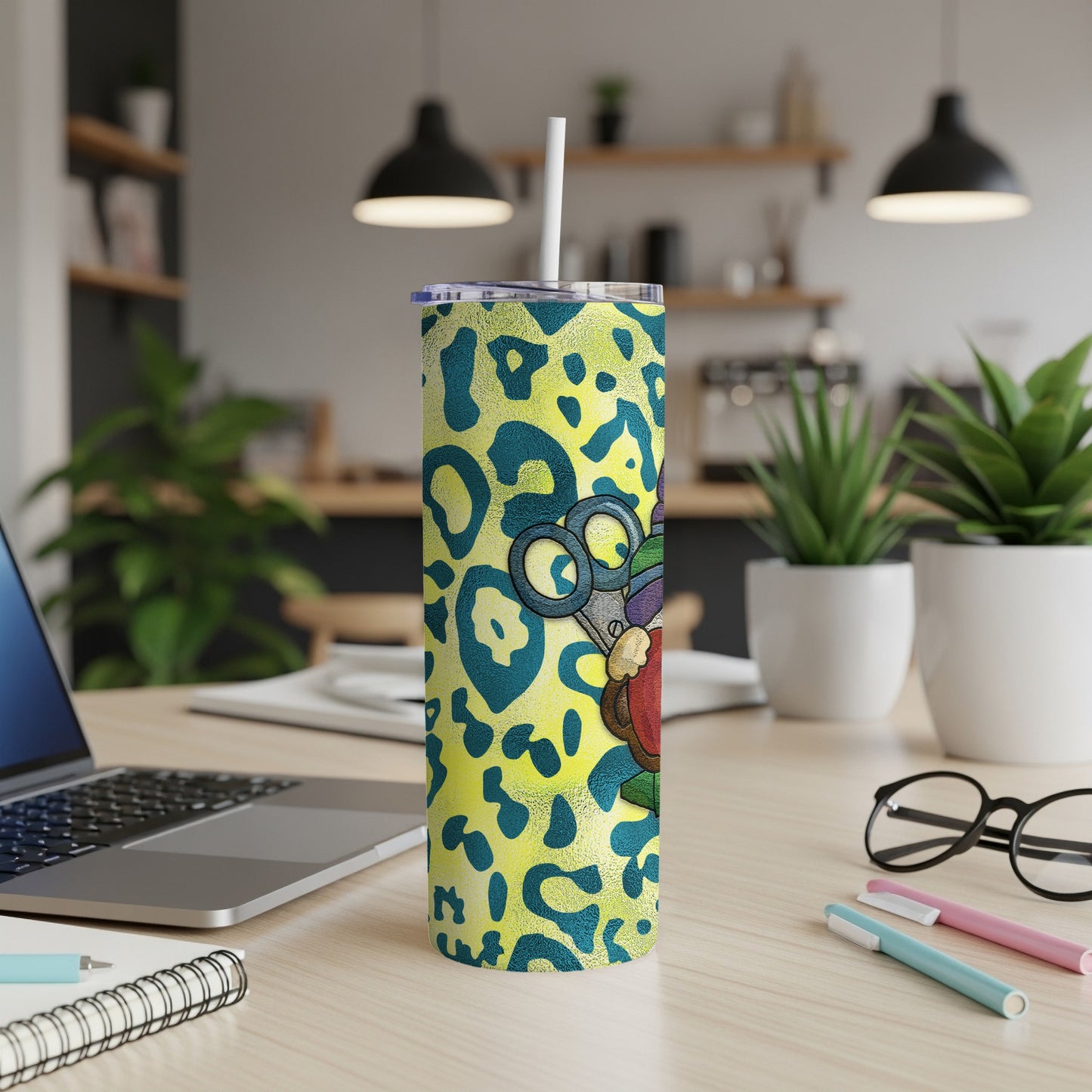 Yellow leopard print tumbler with cartoon scissors, heart, and sewing needle design.