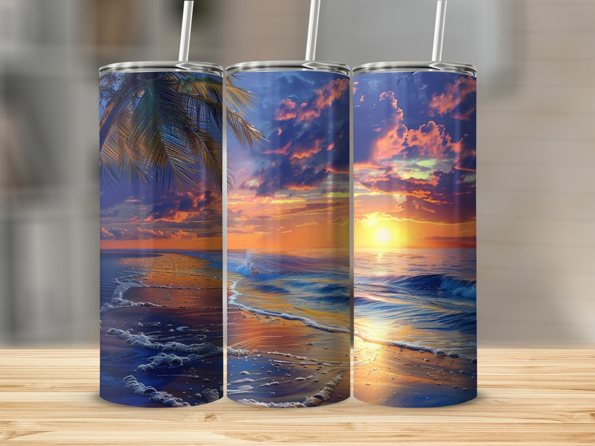 Three tumblers with a beach sunset design.