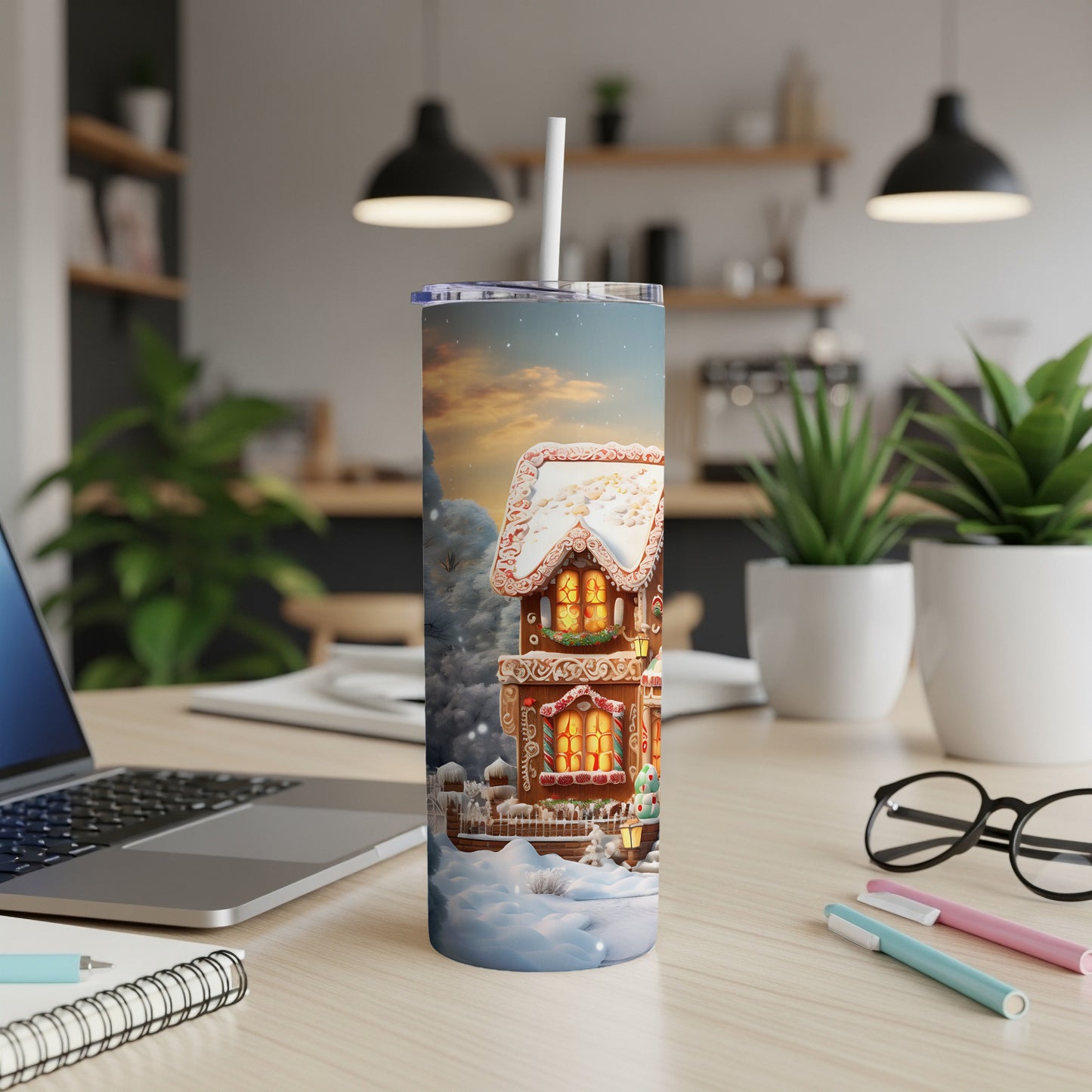 Gingerbread house tumbler with straw, detailed snowy Christmas scene.