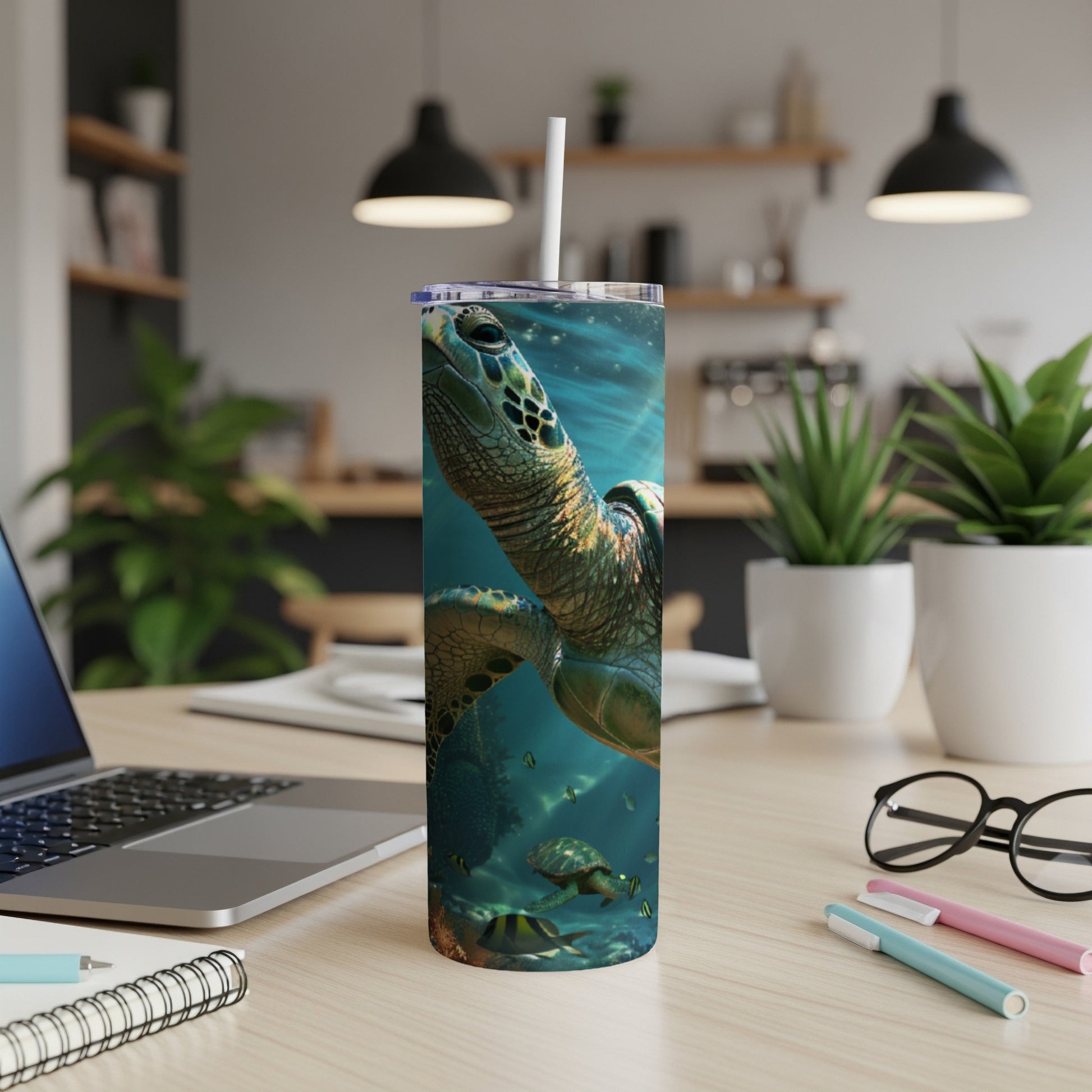 Sea turtle swimming underwater on a tall, insulated tumbler with a straw.