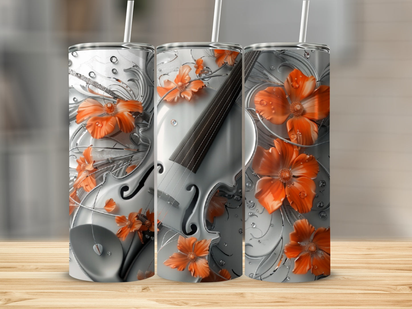 Silver violin with orange flowers design on a tumbler.