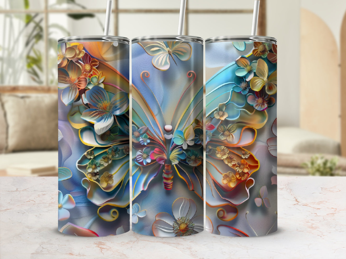 Floral butterfly design on three tall, cylindrical tumblers with straws.
