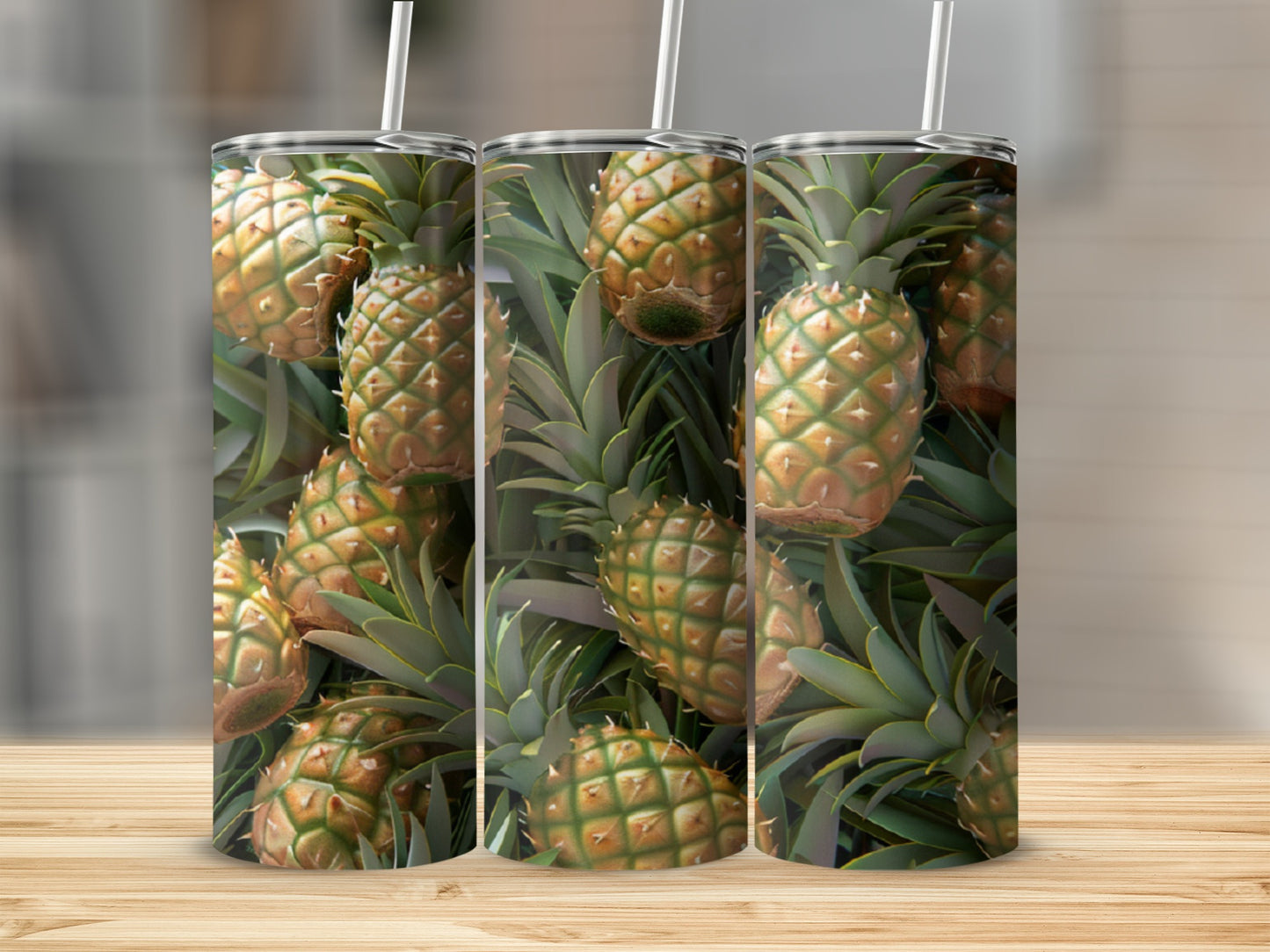 Three tumblers showcasing a pattern of ripe pineapples with green leaves.
