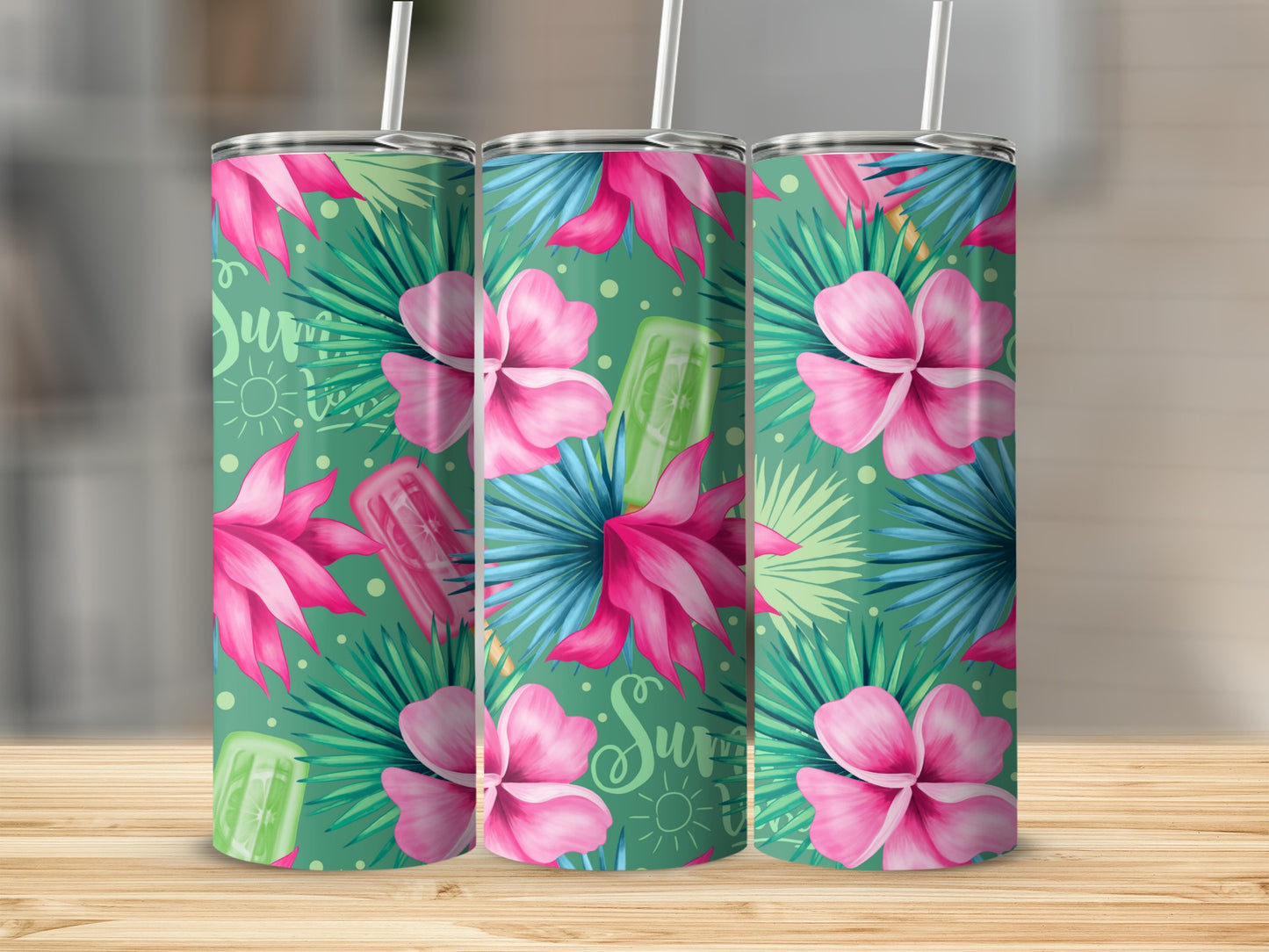 Three tumblers with a tropical floral pattern and popsicles.