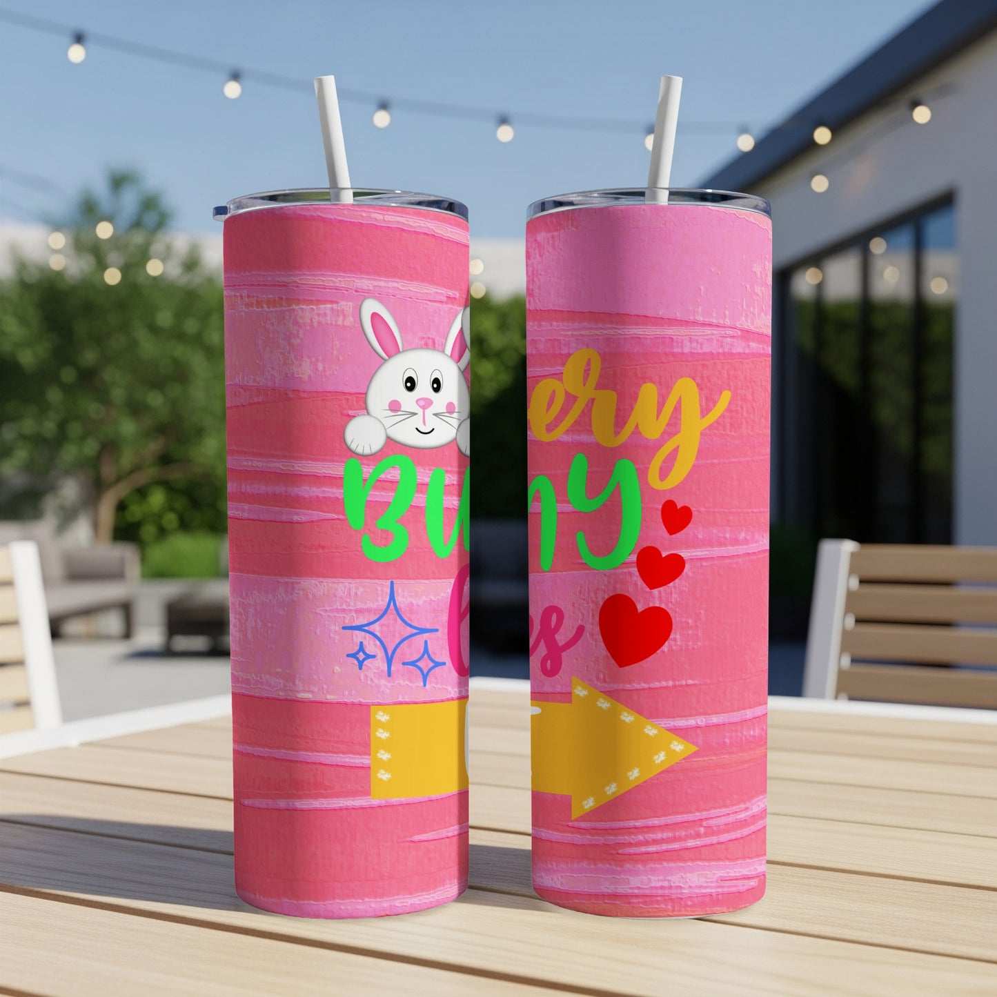 Two pink tumblers with a bunny and "Very Bunny" text on a table.