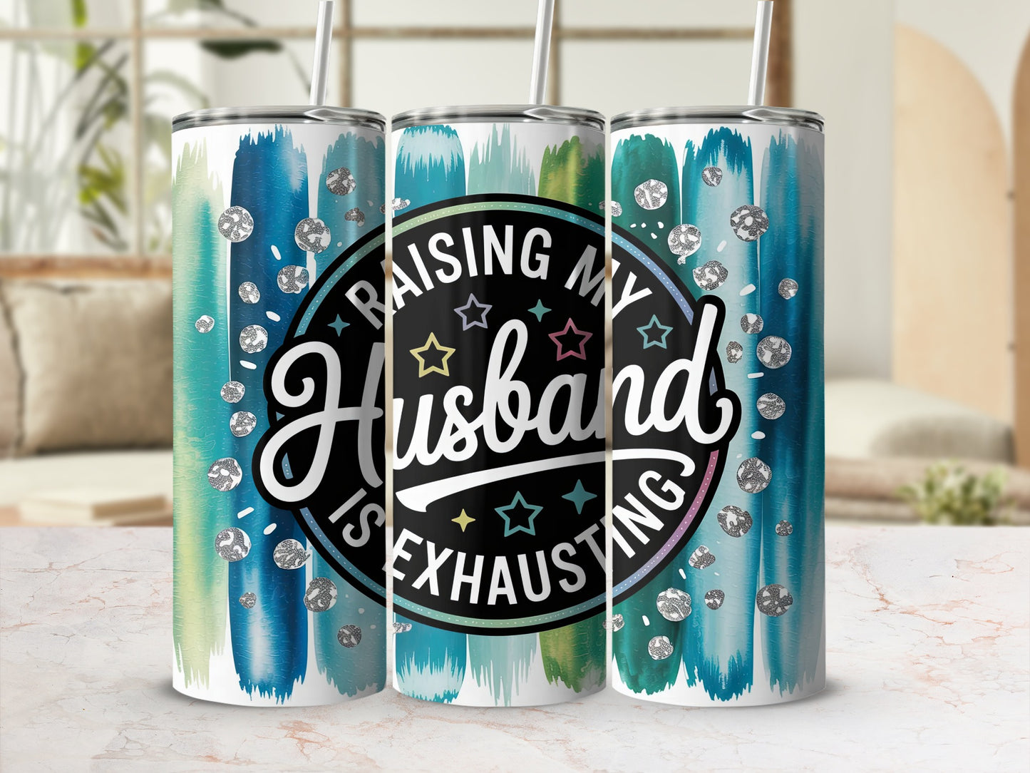 Tumbler with "Raising My Husband is Exhausting" text and colorful brush strokes.