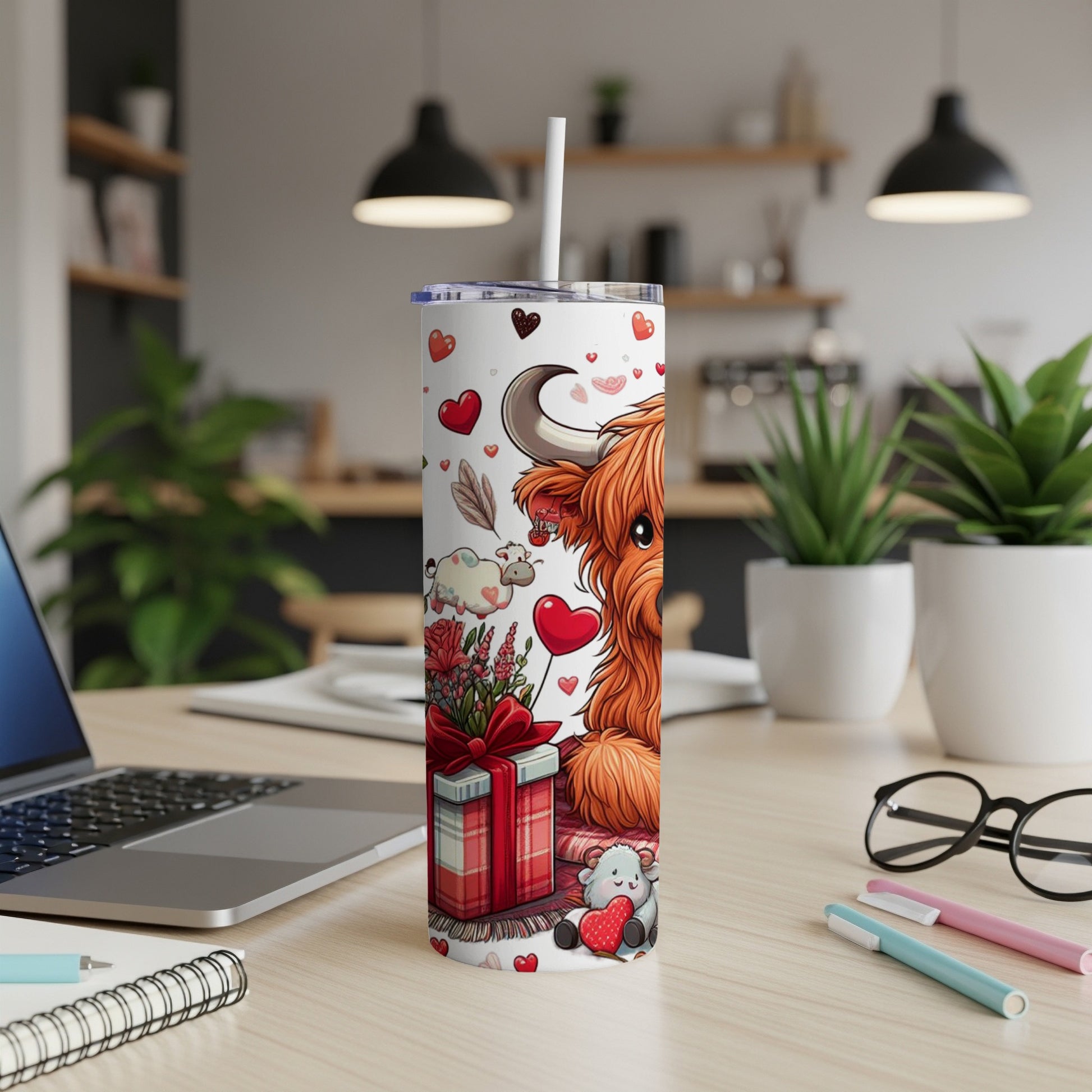 Highland cow with hearts, gift box, and floral accents on a tumbler.