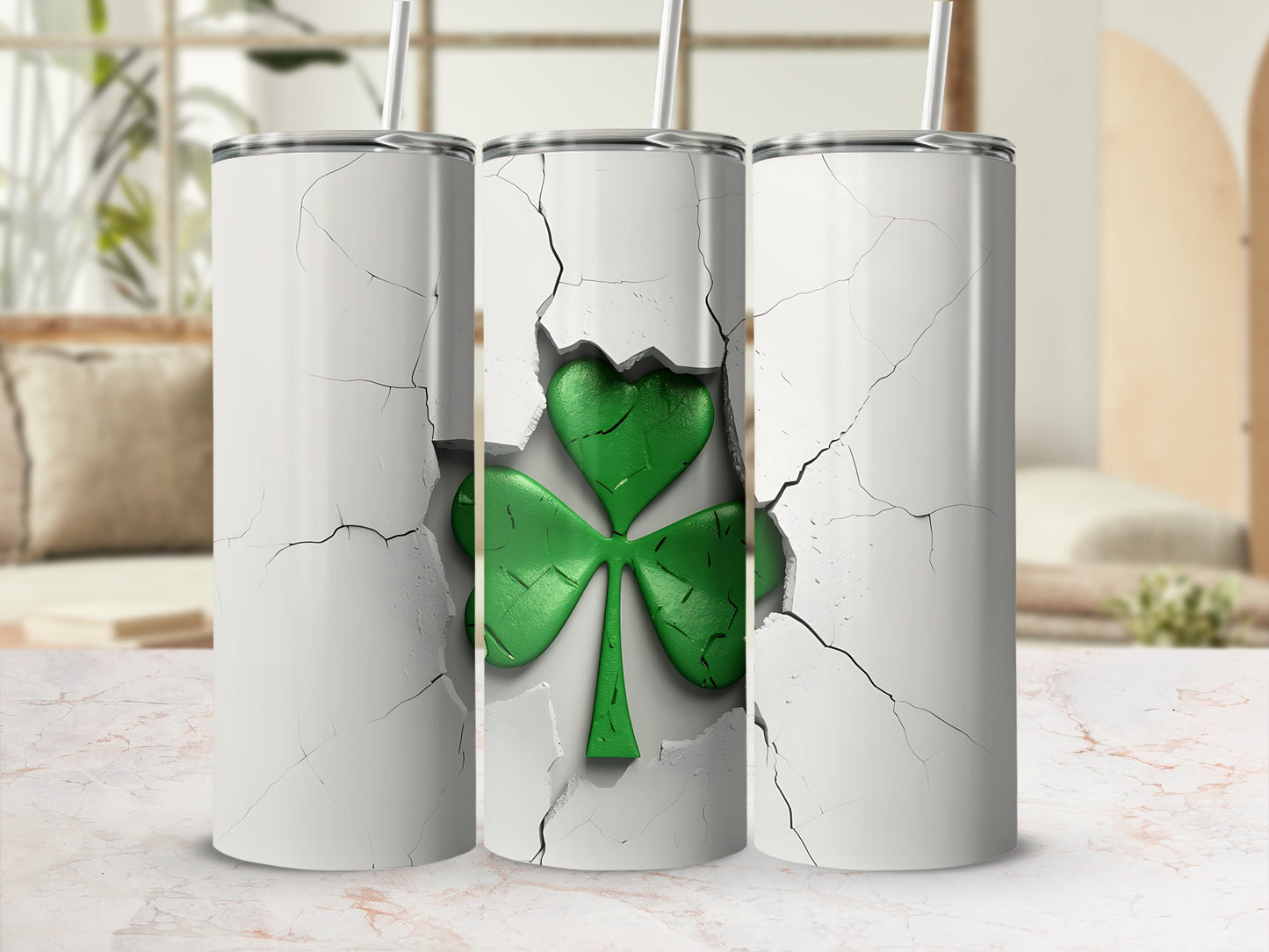 Three tumblers with cracked white exteriors revealing green shamrocks.
