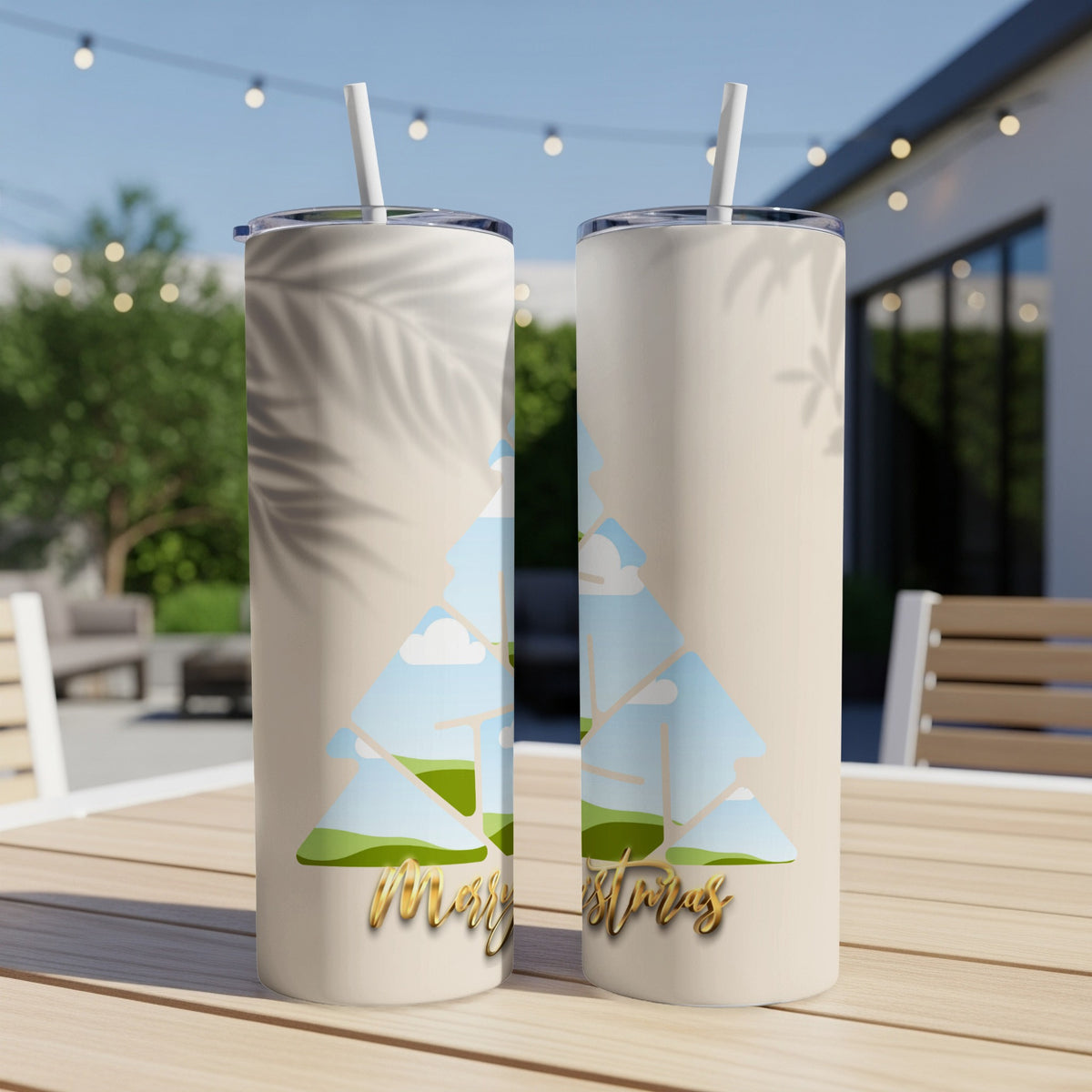 Two tan tumblers with a Christmas tree design and "Merry Christras" text.