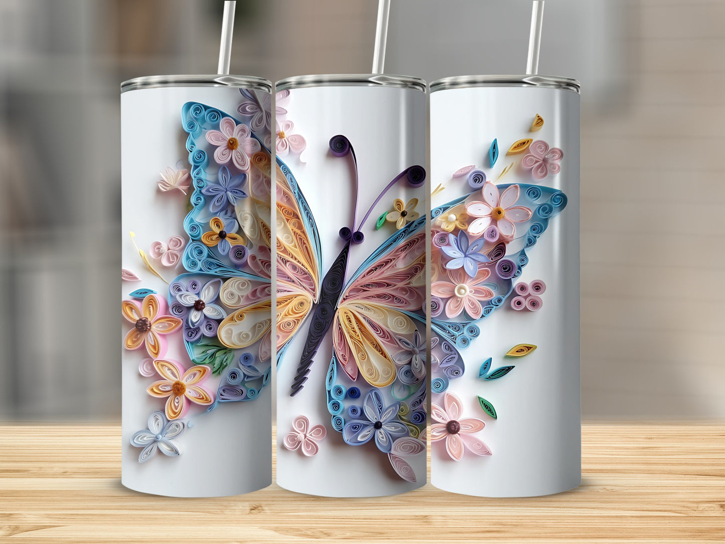 Tumblers with a pastel quilled butterfly and floral design.