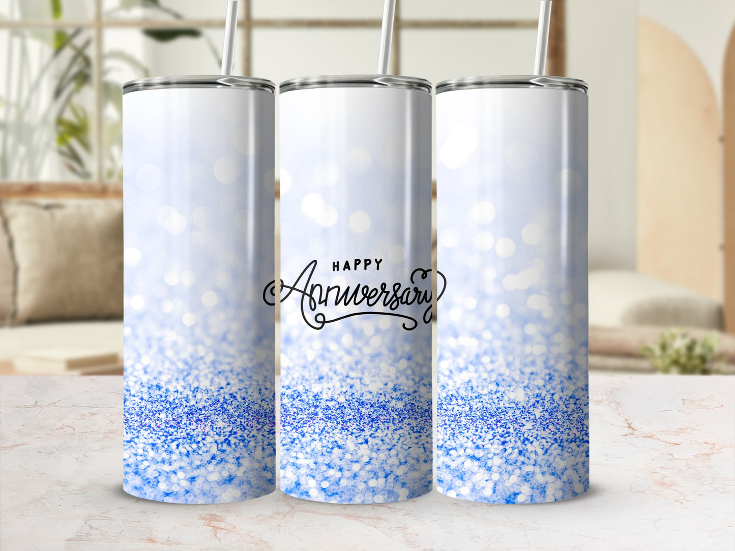White tumbler with blue glitter and "Happy Anniversary" text.