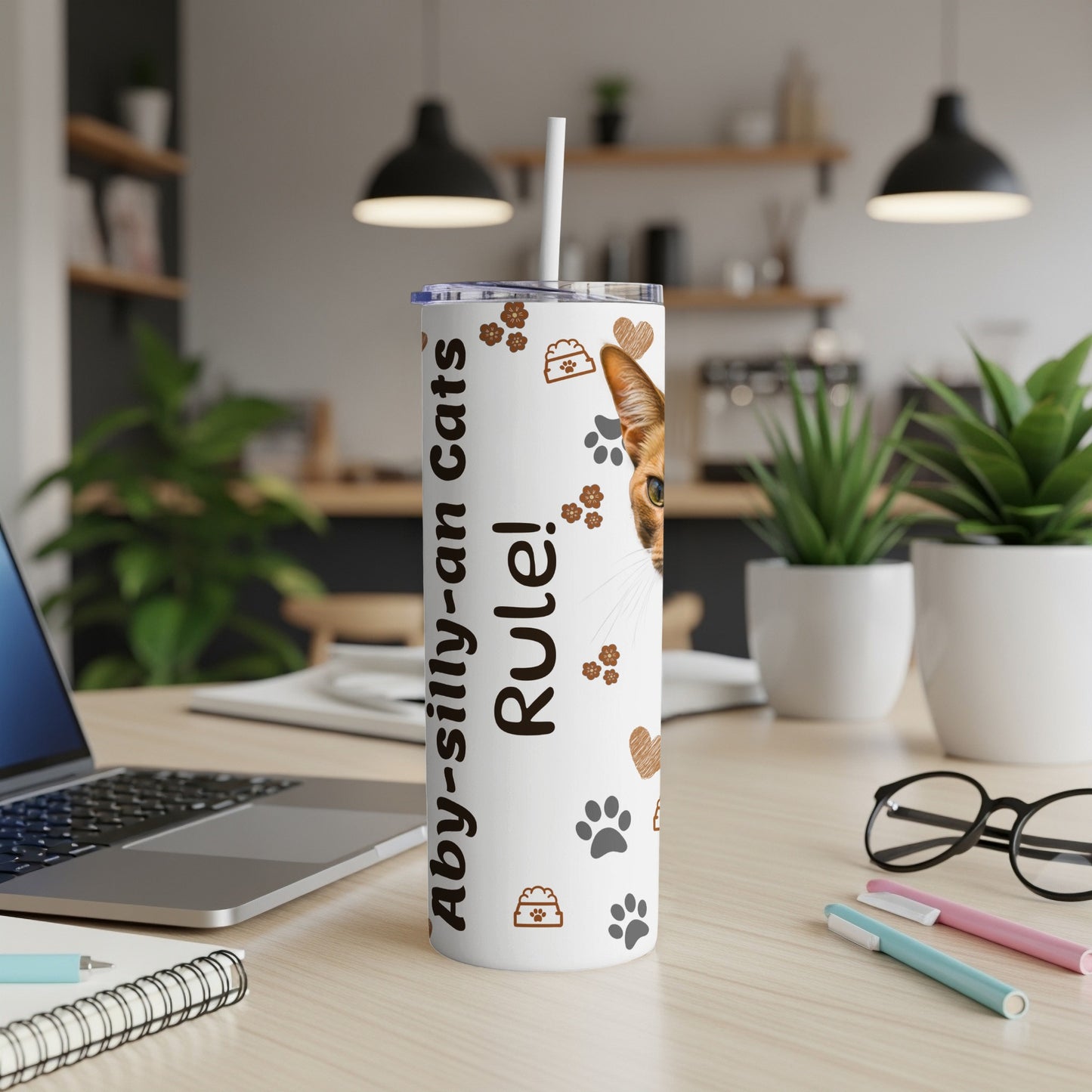 White tumbler with brown cat paw prints and text "Aby-silly-an cats Rule!".