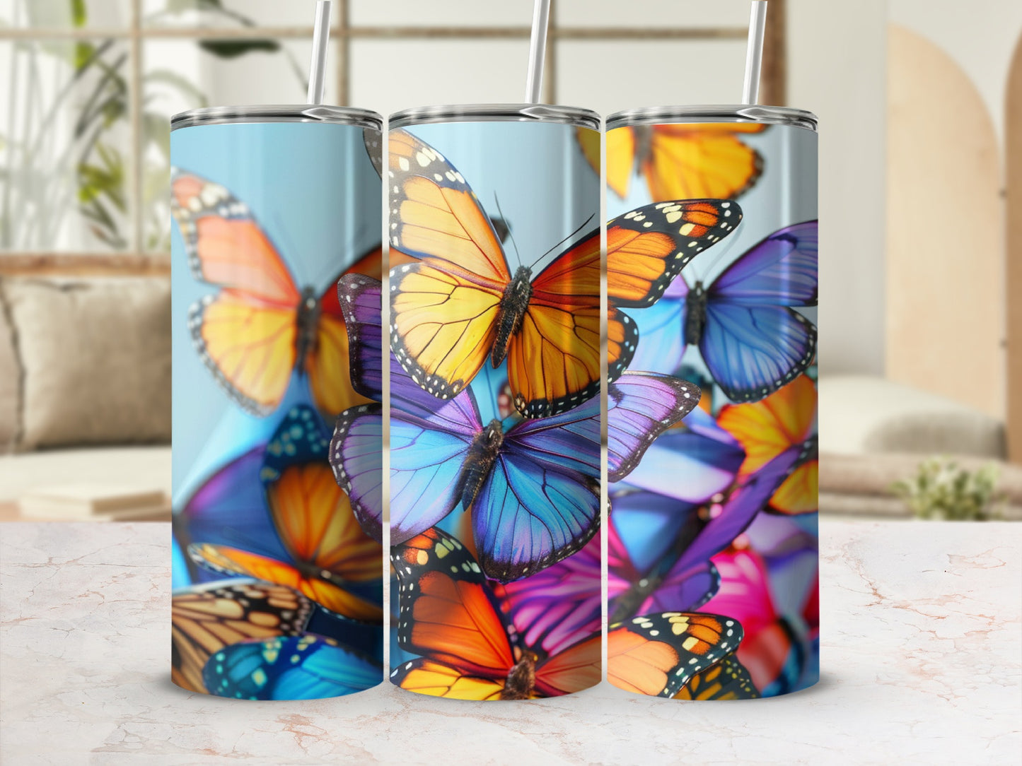 Three tumblers featuring a collage of vibrant monarch and blue morpho butterflies.