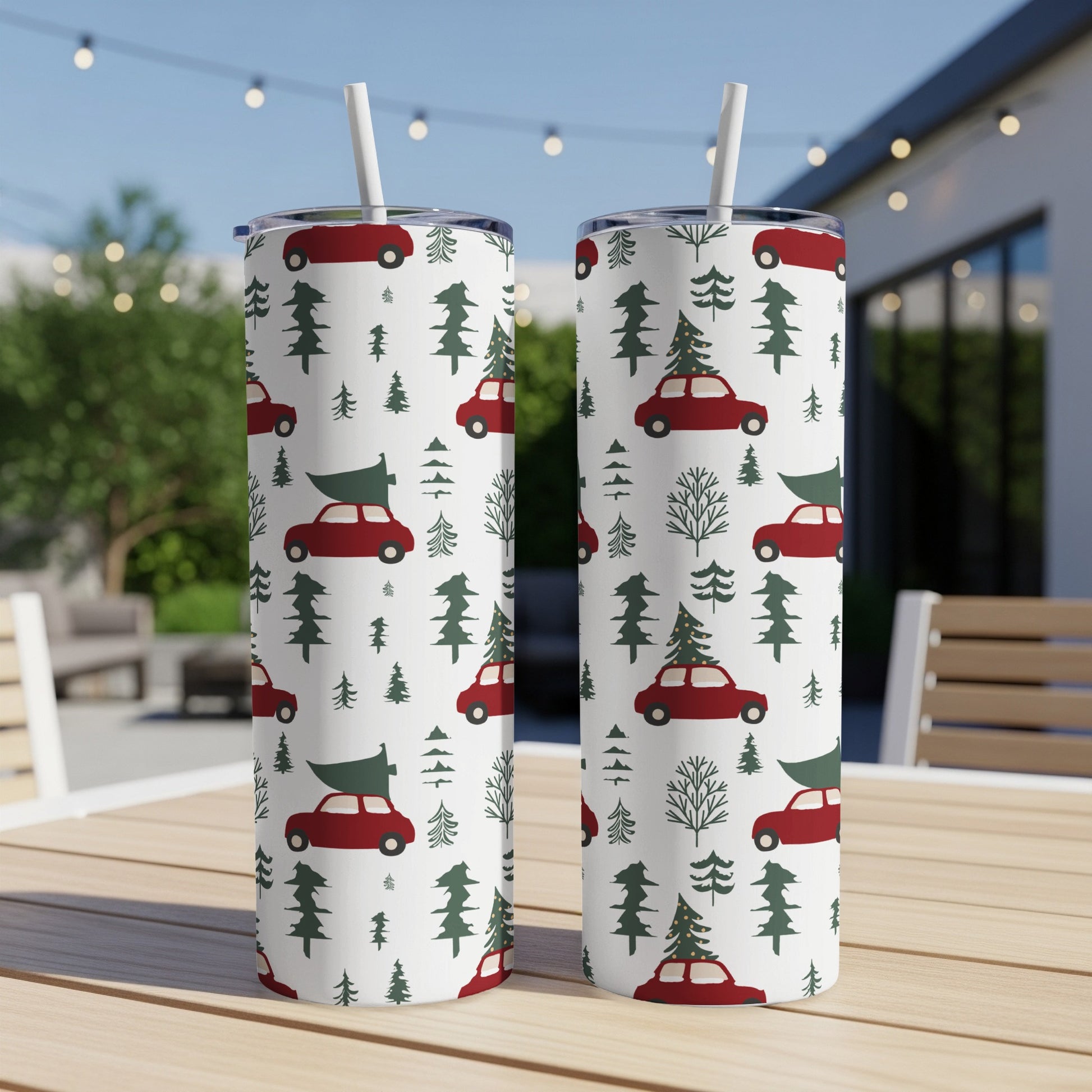 Two tumblers with a red car and Christmas tree pattern.