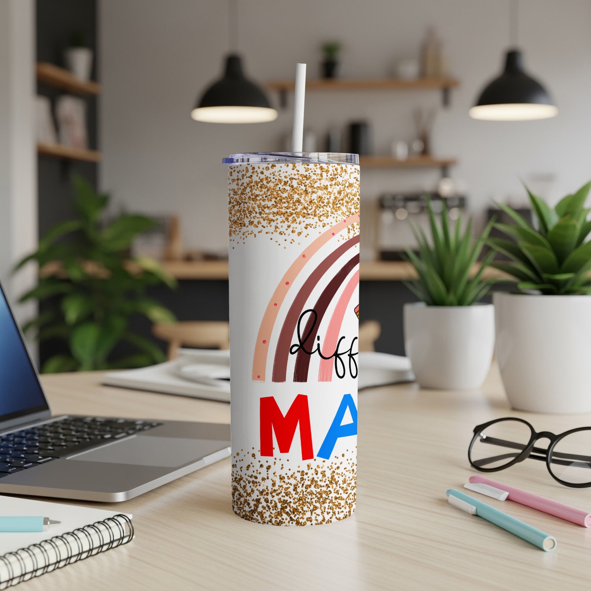 White tumbler with colorful rainbow and "Mama" text.