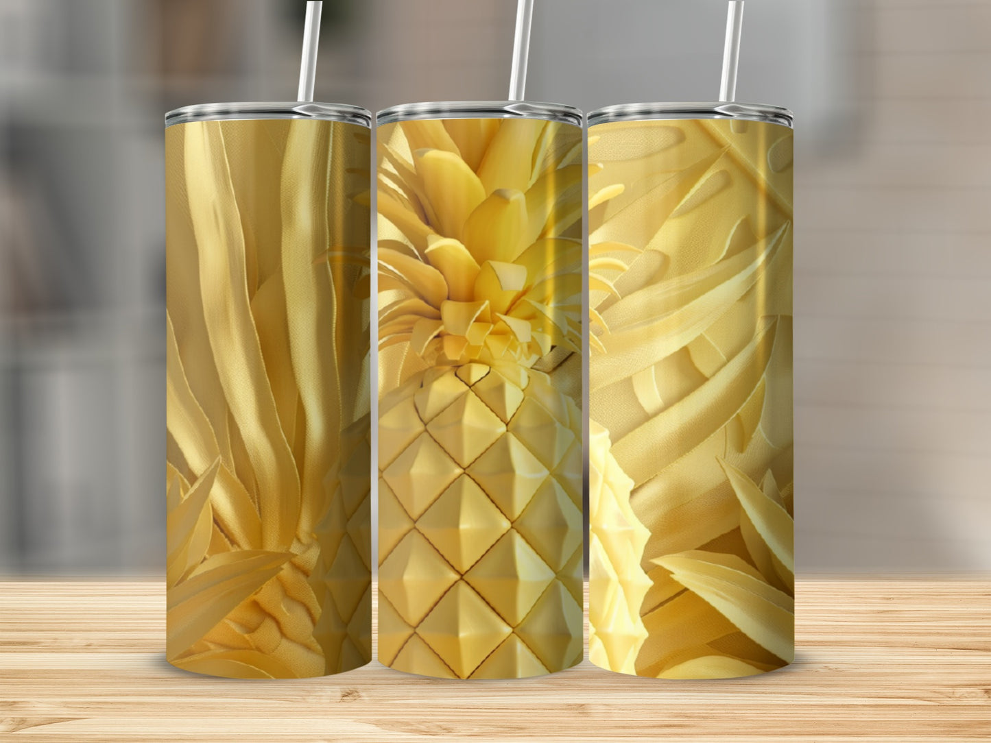 Triptych of gold pineapple tumblers with straws on a wooden surface.