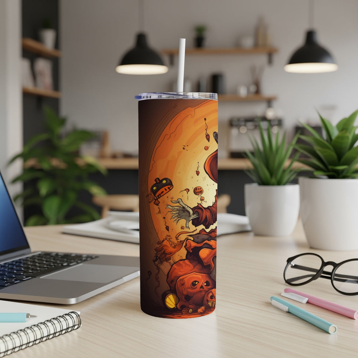 Tall tumbler with a Halloween-themed illustration featuring pumpkins, a skeleton hand, and a ghost.