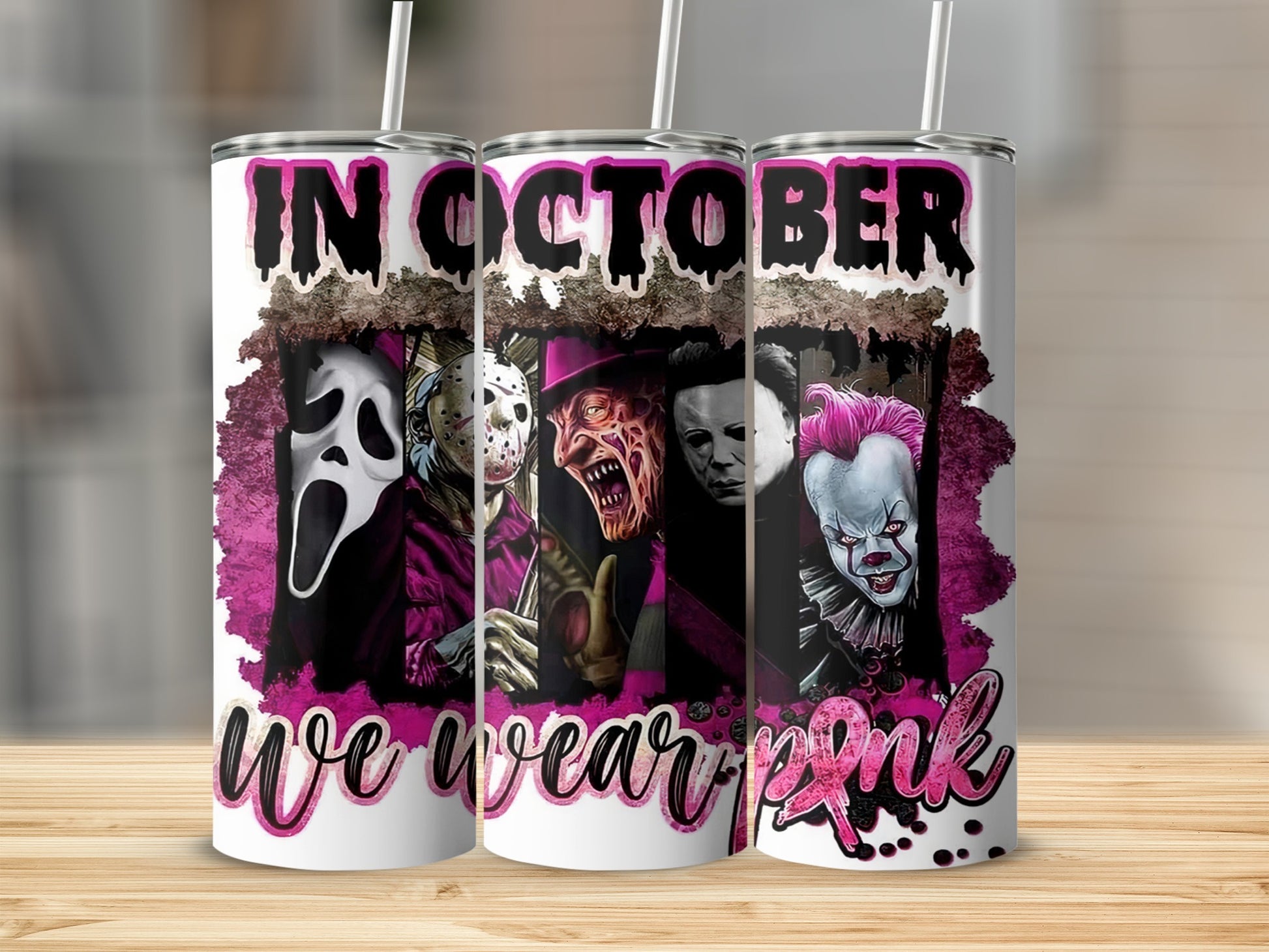 Tumbler with horror movie characters and "In October we wear pink" text.