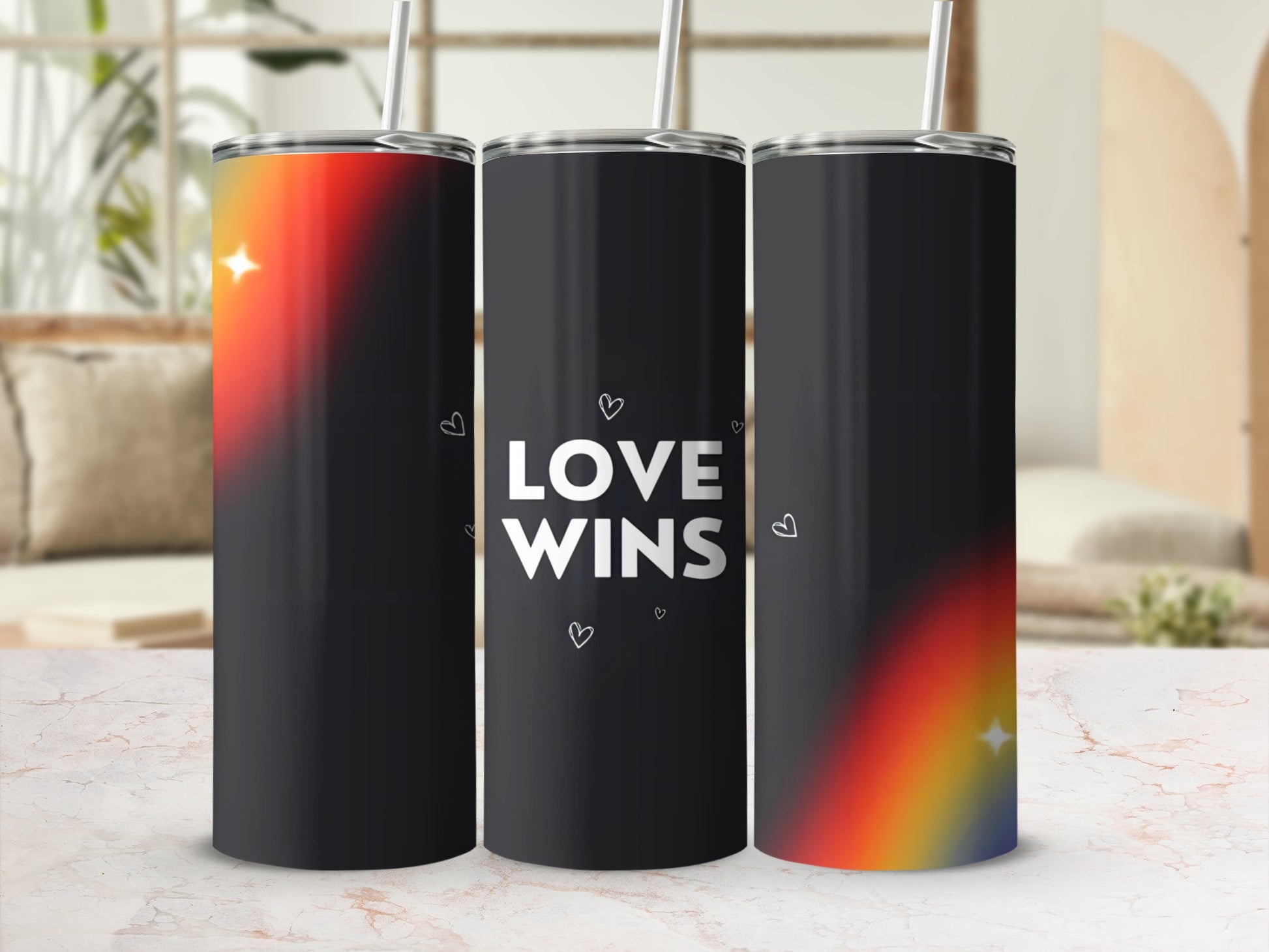 Three tumblers with rainbow gradients and "Love Wins" text.
