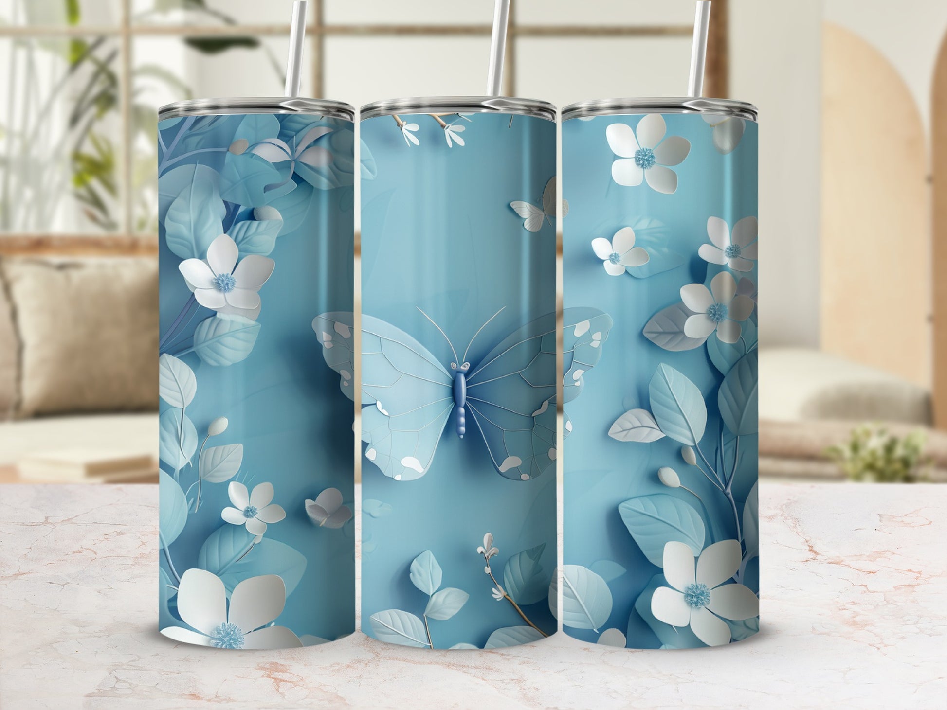 Blue tumbler with butterfly and floral pattern.