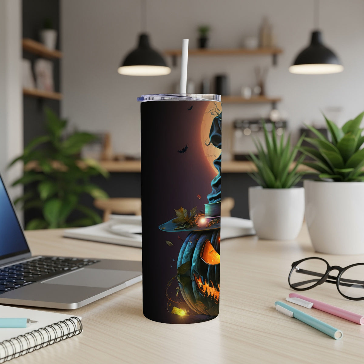 Black tumbler with a Halloween pumpkin design featuring a witch's hat and a full moon.