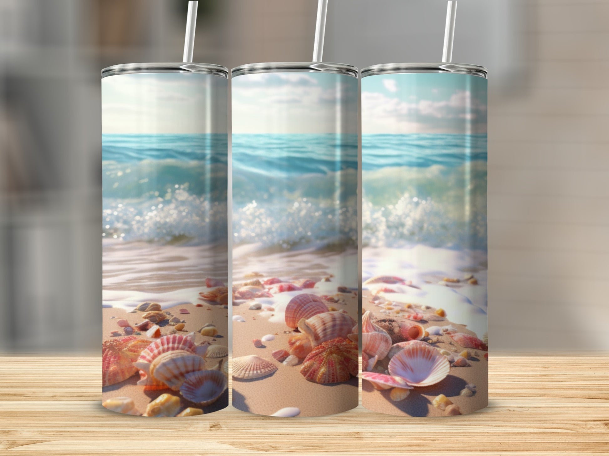 Three tumblers featuring a beach scene with seashells and ocean waves.