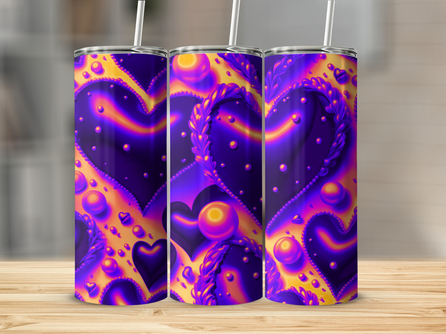 Three tumblers with purple and orange swirling heart and bubble design.